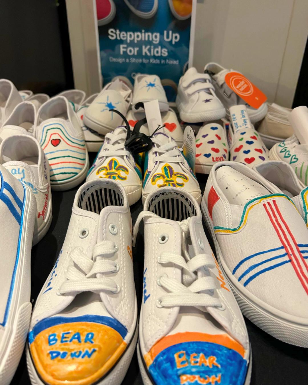 Completed hand-painted shoes created during ACCENT New Orleans’ Stepping Up for Kids team building giveback activity.