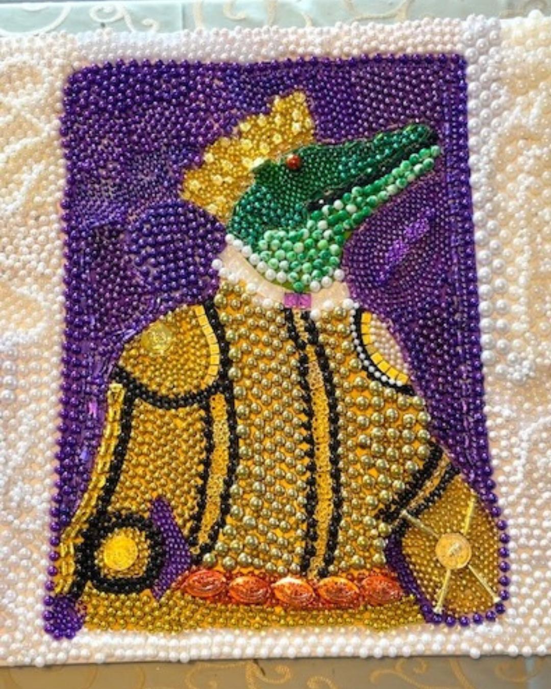 Finished Mardi Gras bead art portrait of a royal alligator for The Royal Sonesta New Orleans, created during an ACCENT New Orleans DMC corporate team building workshop.