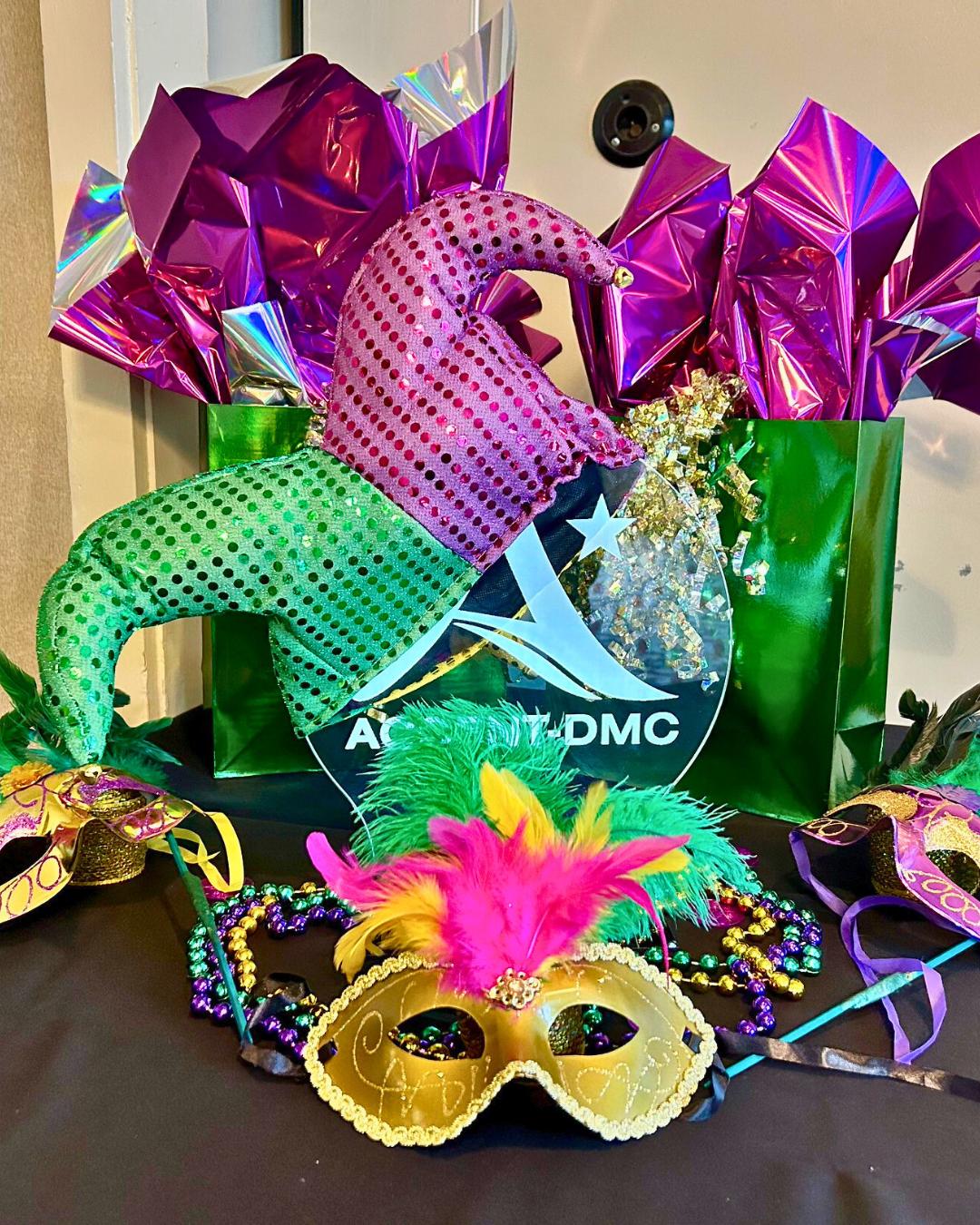 Mardi Gras mask-making supplies and themed gift bags arranged for a New Orleans creative workshop hosted by ACCENT New Orleans DMC.